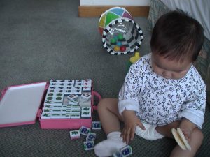 She plays her own version of Mah Jong.